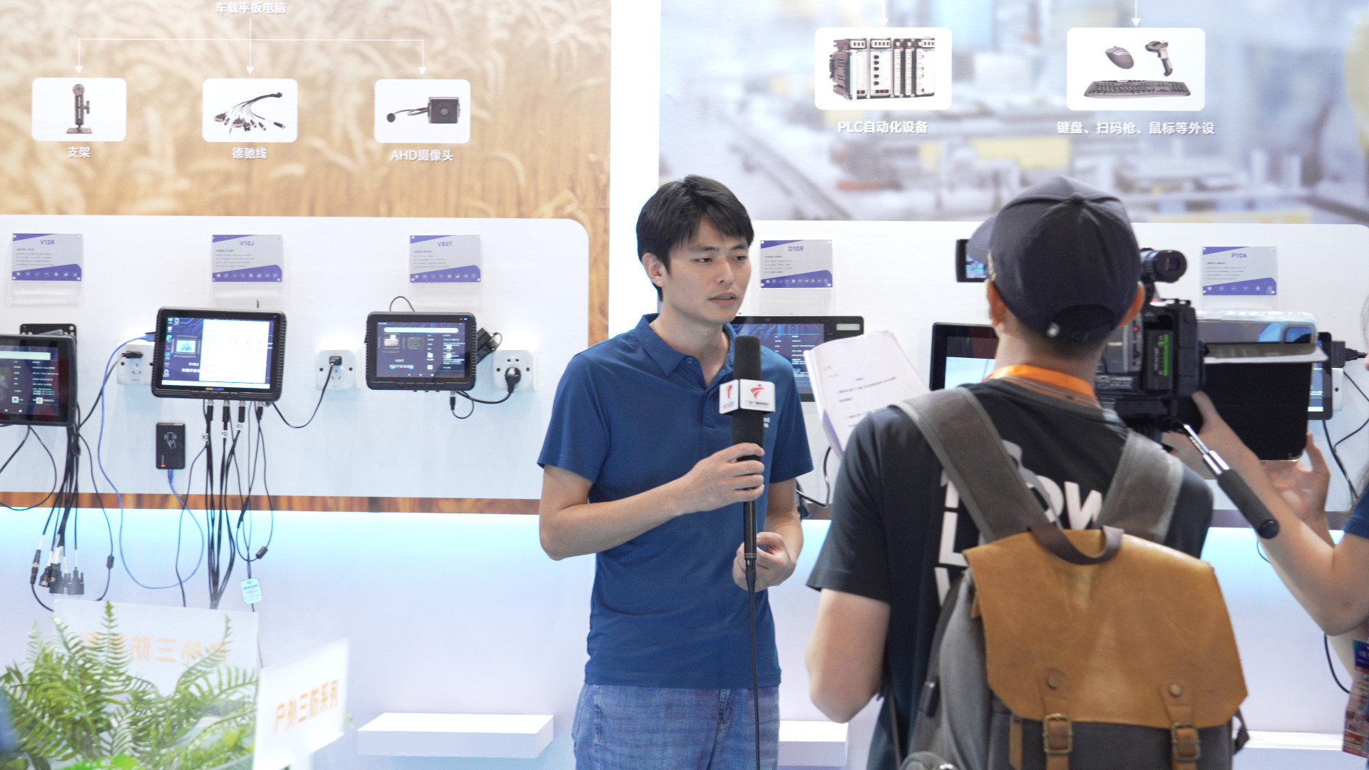 An ONERugged representative being interviewed by Guangdong Radio and Television at the IOTE 2025 exhibition.